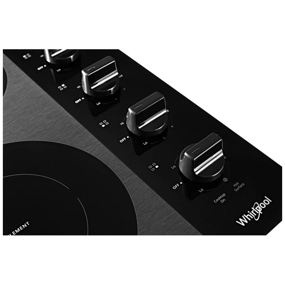 Right-side control panel with black dishwasher-safe knobs for precise heat adjustment.